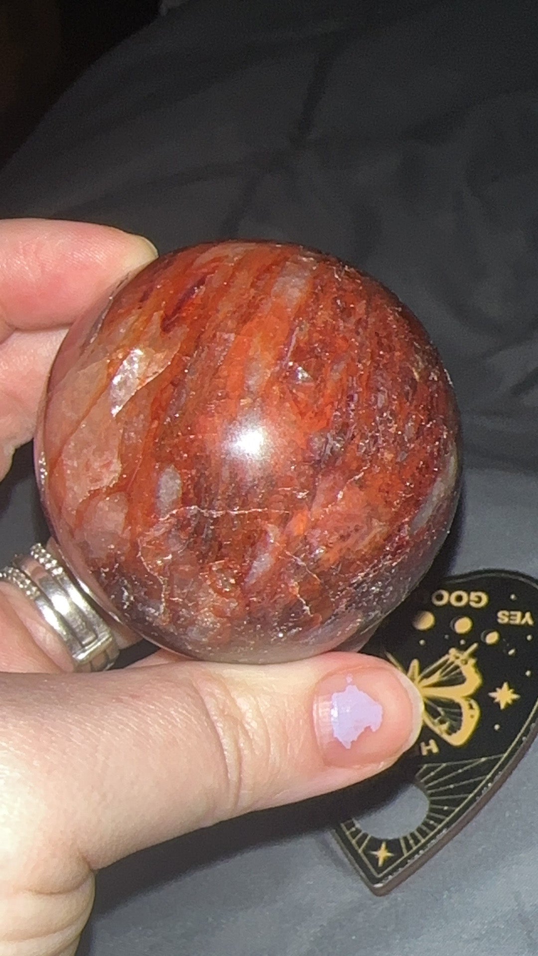 5.5cm red fire quartz sphere with vivid hematite inclusions