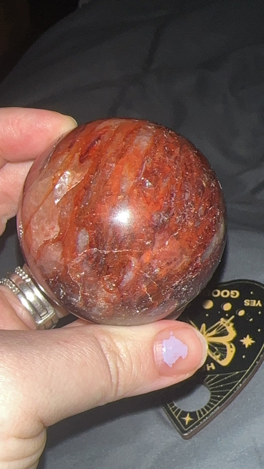 5.5cm red fire quartz sphere with vivid hematite inclusions