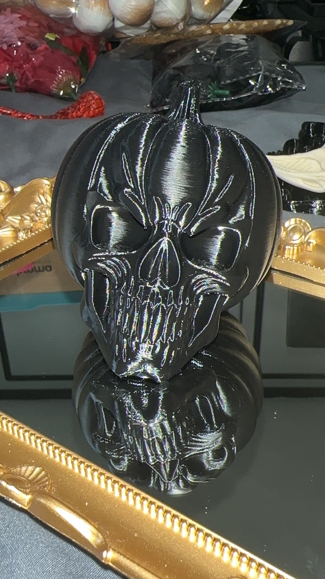 Black 3D printed pumpkin skull front view