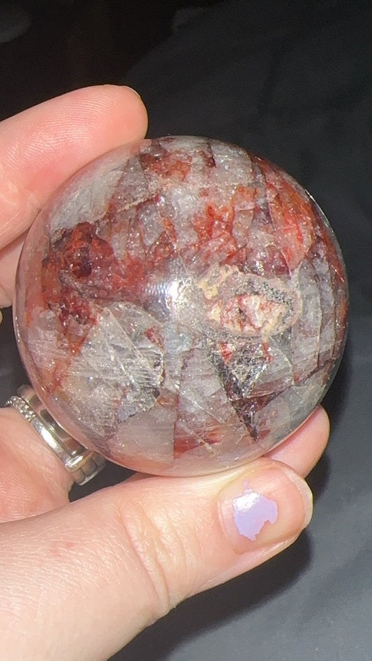 5cm fire quartz sphere with large internal rainbows