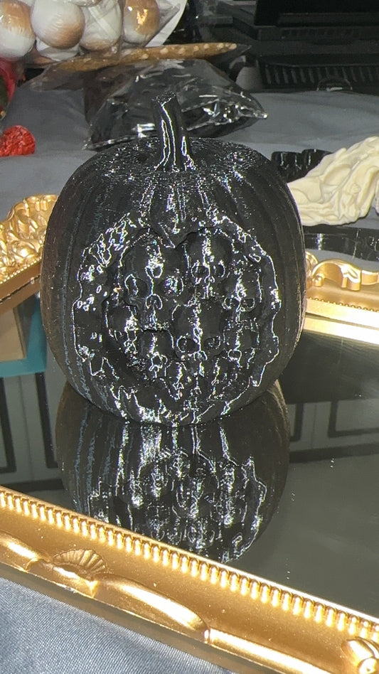 Black 3D printed rotten apple filled with skulls